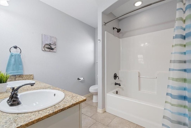 full bathroom with vanity, tile patterned floors, toilet, and shower / bath combo with shower curtain