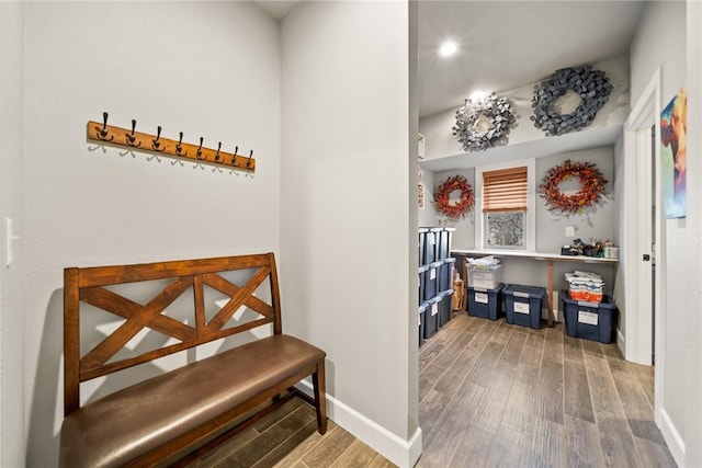 hallway with light wood-style floors and baseboards