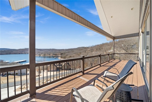 wooden deck with a water view