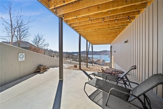 view of patio featuring a water view