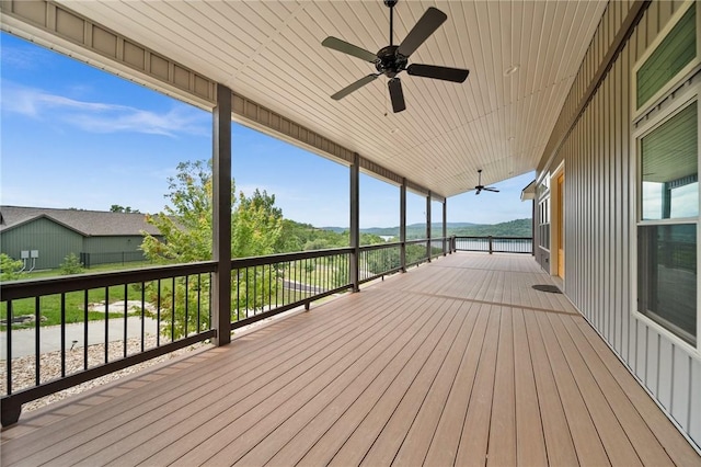 14137 Ozark Dr, Garfield, AR 72732 - wooden terrace with a ceiling fan and a water view