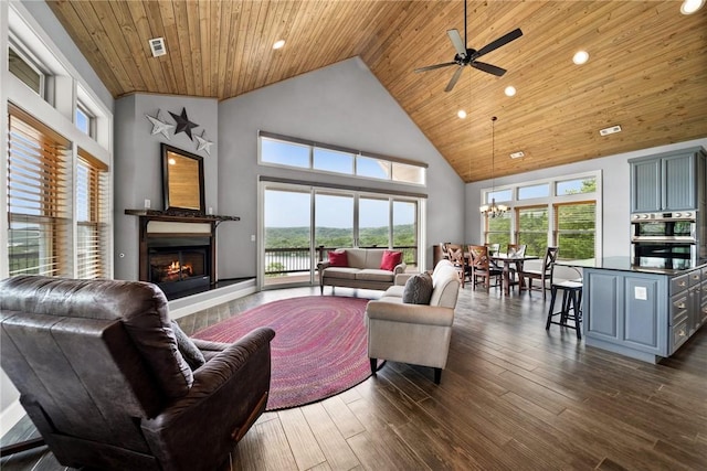 14137 Ozark Dr, Garfield, AR 72732 - living area with a warm lit fireplace, wooden ceiling, high vaulted ceiling, a ceiling fan, and healthy amount of natural light