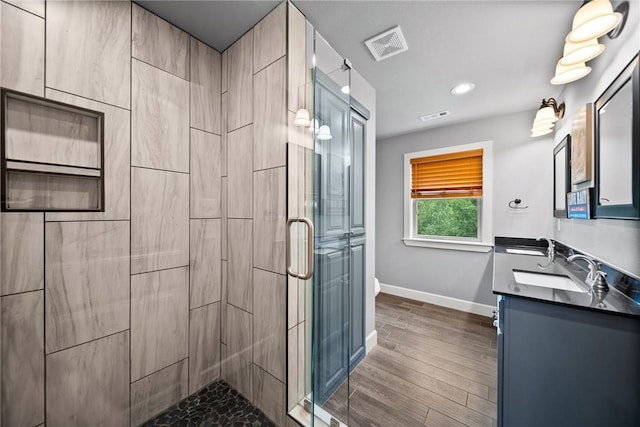 14137 Ozark Dr, Garfield, AR 72732 - full bath with a stall shower, double vanity, recessed lighting, and wood finished floors