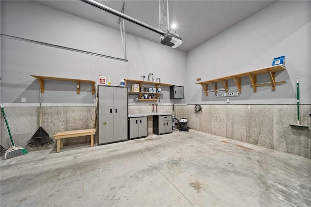 14137 Ozark Dr, Garfield, AR 72732 - garage featuring a garage door opener