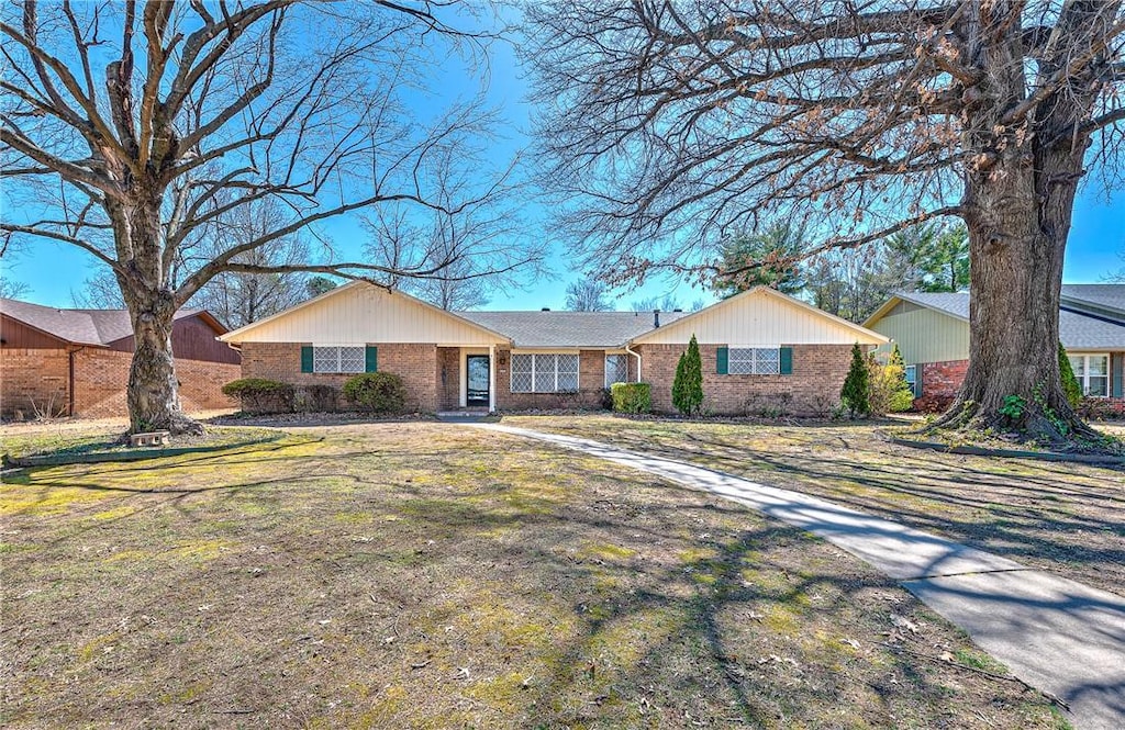 2201 Camino Real, Springdale, AR 72762 - ranch-style home featuring brick siding and a front lawn