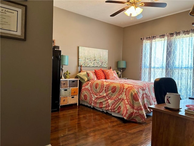 bedroom featuring a ceiling fan and wood finished floors