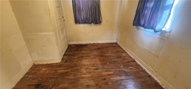 empty room with hardwood / wood-style flooring