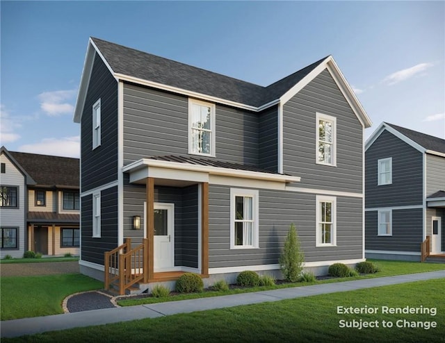 view of front of home featuring metal roof, a standing seam roof, and a front yard