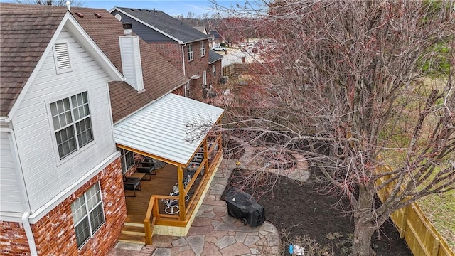 view of property exterior featuring a chimney