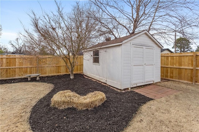 view of shed featuring a fenced backyard