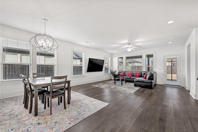 dining area with recessed lighting, baseboards, dark wood finished floors, and ceiling fan with notable chandelier