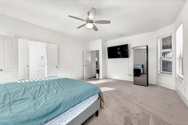 carpeted bedroom with baseboards and a ceiling fan