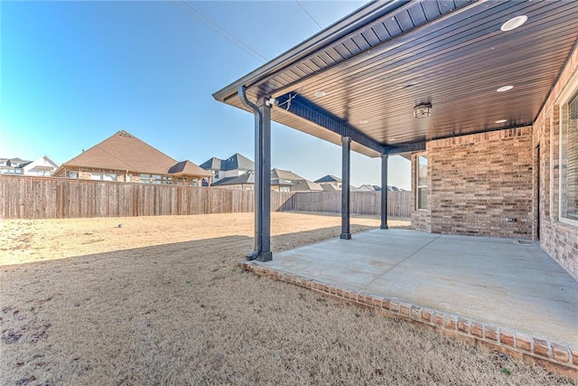 view of patio / terrace with a fenced backyard and a residential view