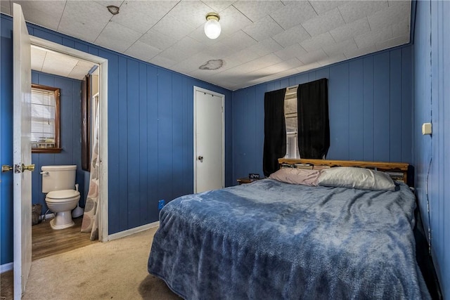 carpeted bedroom with ensuite bath