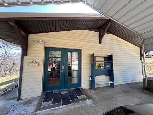 view of exterior entry featuring french doors