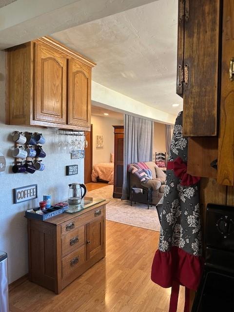 kitchen with open floor plan and light wood-style flooring