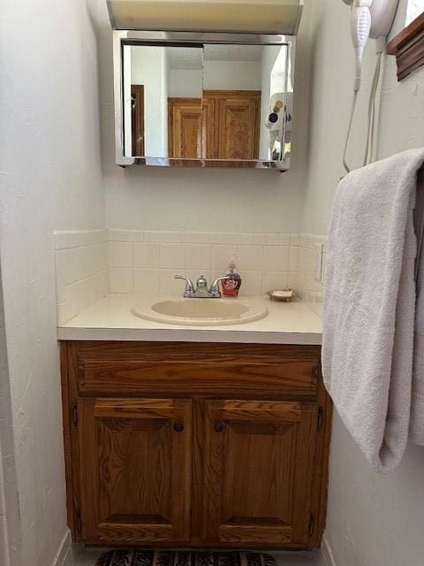 bathroom featuring vanity and baseboards