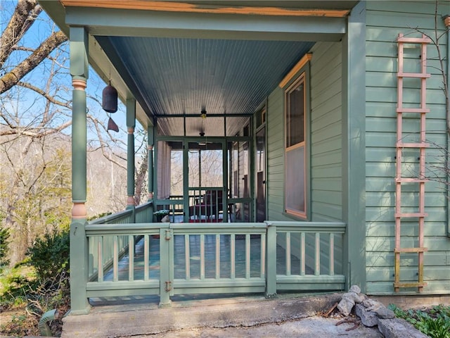 wooden terrace with a porch