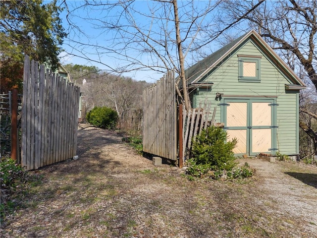 view of shed with fence