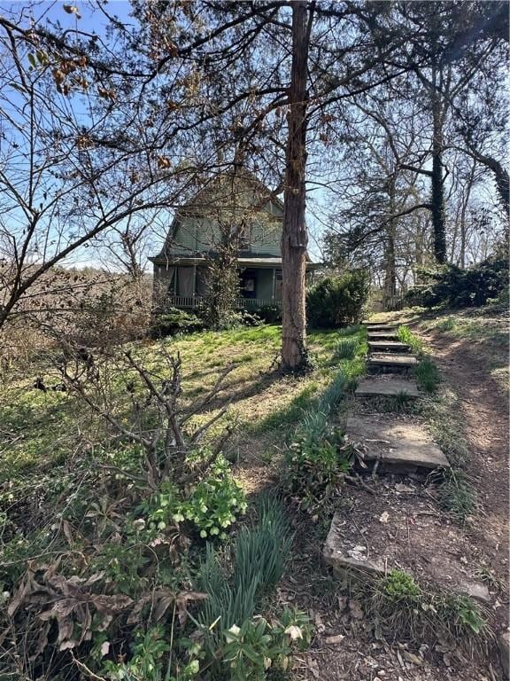 view of yard with covered porch