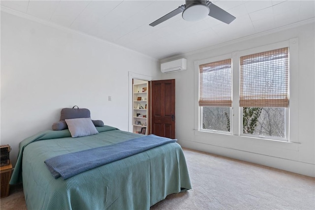 carpeted bedroom featuring ornamental molding, a ceiling fan, and a wall mounted AC