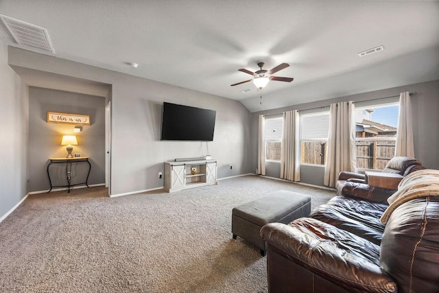 living room featuring visible vents, baseboards, ceiling fan, and vaulted ceiling