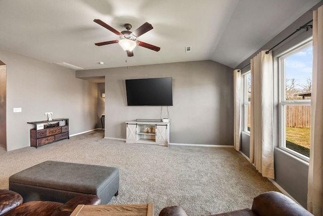 carpeted living room featuring visible vents, baseboards, a ceiling fan, and vaulted ceiling