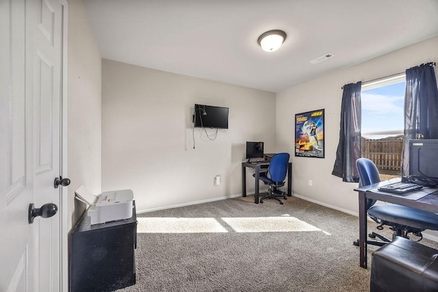 carpeted home office with baseboards and visible vents