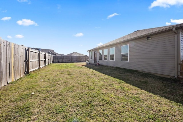 view of yard featuring a fenced backyard