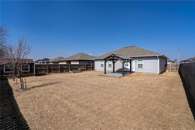 view of yard with a gazebo, a fenced backyard, and a patio