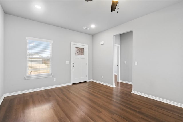 interior space featuring recessed lighting, baseboards, dark wood-type flooring, and ceiling fan