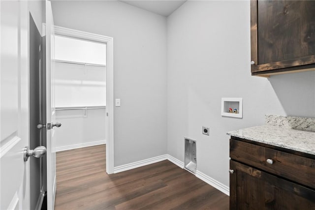 laundry room featuring washer hookup, dark wood-type flooring, cabinet space, and hookup for an electric dryer