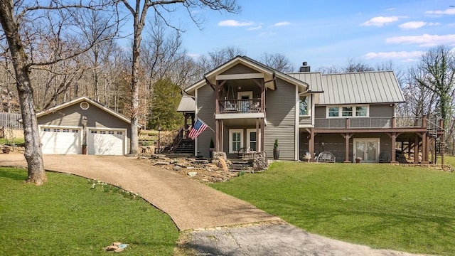 chalet / cabin with driveway, a chimney, stairs, and a front lawn