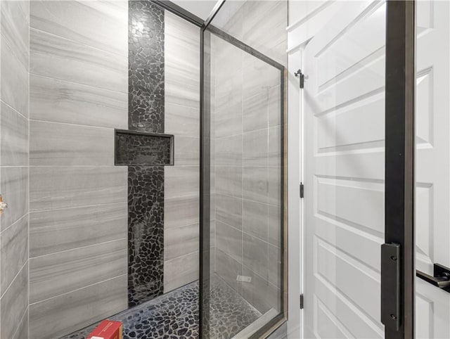 bathroom featuring a shower stall