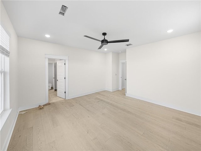 unfurnished room with visible vents, baseboards, recessed lighting, light wood-style flooring, and a ceiling fan