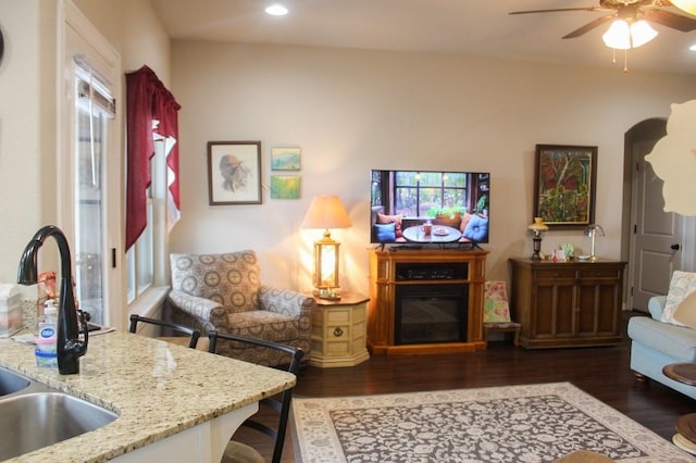 living room featuring arched walkways, recessed lighting, a ceiling fan, and wood finished floors