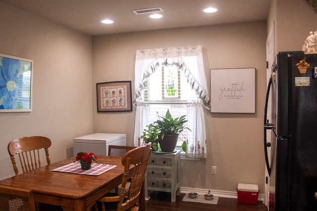 dining room with recessed lighting, dark wood-style floors, visible vents, and baseboards