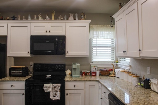 kitchen featuring black appliances and white cabinetry