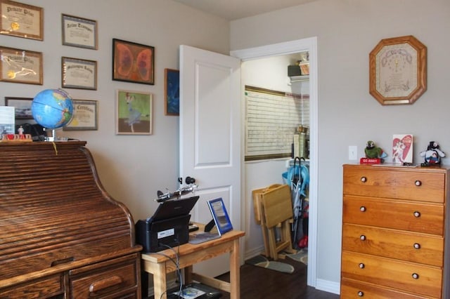 office featuring dark wood finished floors and baseboards