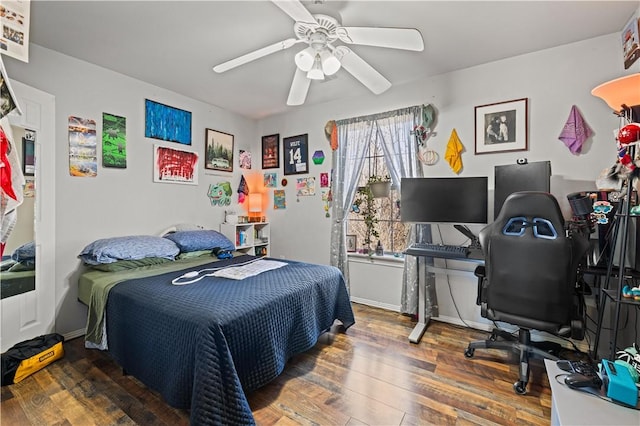 bedroom featuring wood-type flooring and ceiling fan