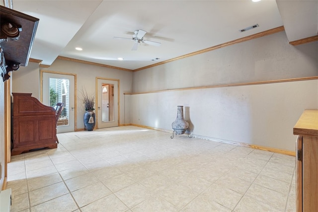 empty room featuring baseboards, visible vents, recessed lighting, ceiling fan, and crown molding