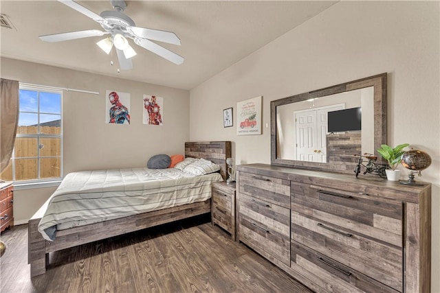 bedroom with dark wood finished floors and visible vents