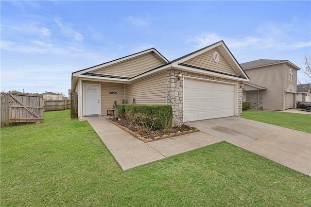 ranch-style home featuring fence, driveway, an attached garage, a front lawn, and stone siding