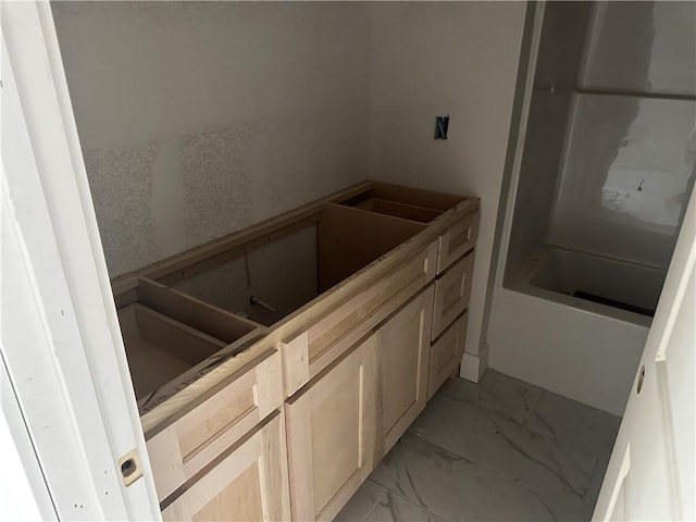 bathroom with marble finish floor