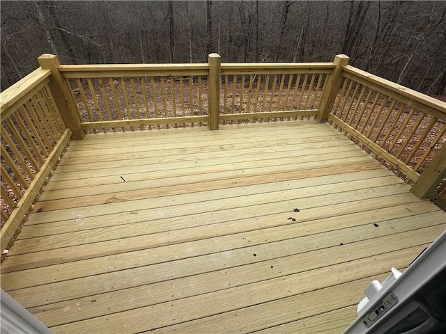 deck featuring a forest view