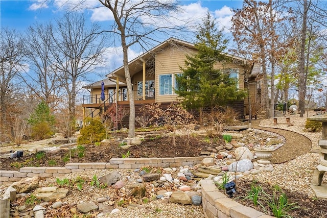 view of home's exterior featuring stairs