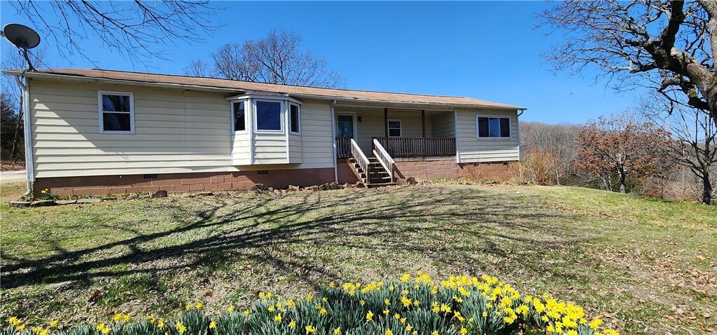 12956 Peppermint Rd, Prairie Grove, AR 72753 - back of house with crawl space, a yard, and covered porch