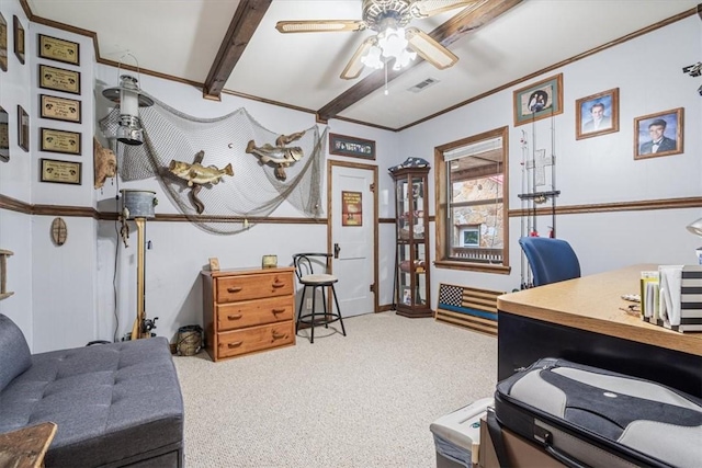 home office with ornamental molding, visible vents, carpet floors, and ceiling fan