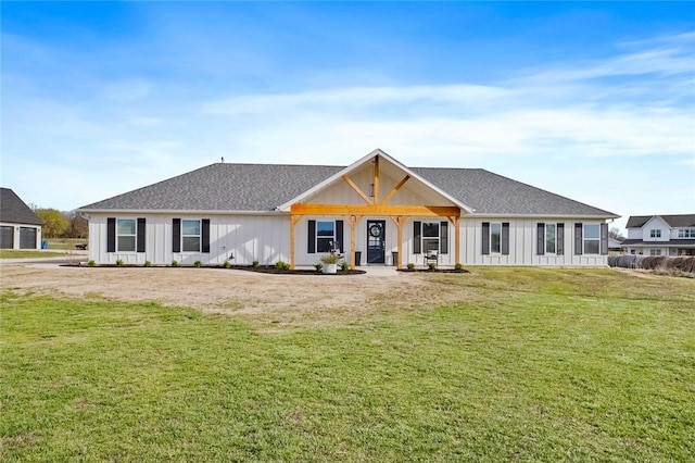 1050 NW Daniels Rd, Bentonville, AR 72713 - view of front facade featuring a front lawn, board and batten siding, and roof with shingles