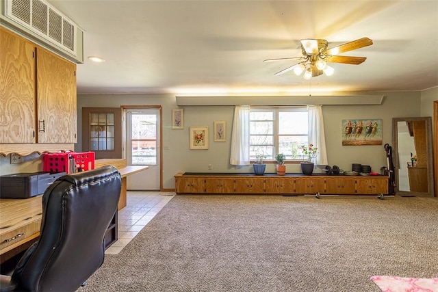 office space with visible vents, light carpet, light tile patterned floors, recessed lighting, and a ceiling fan